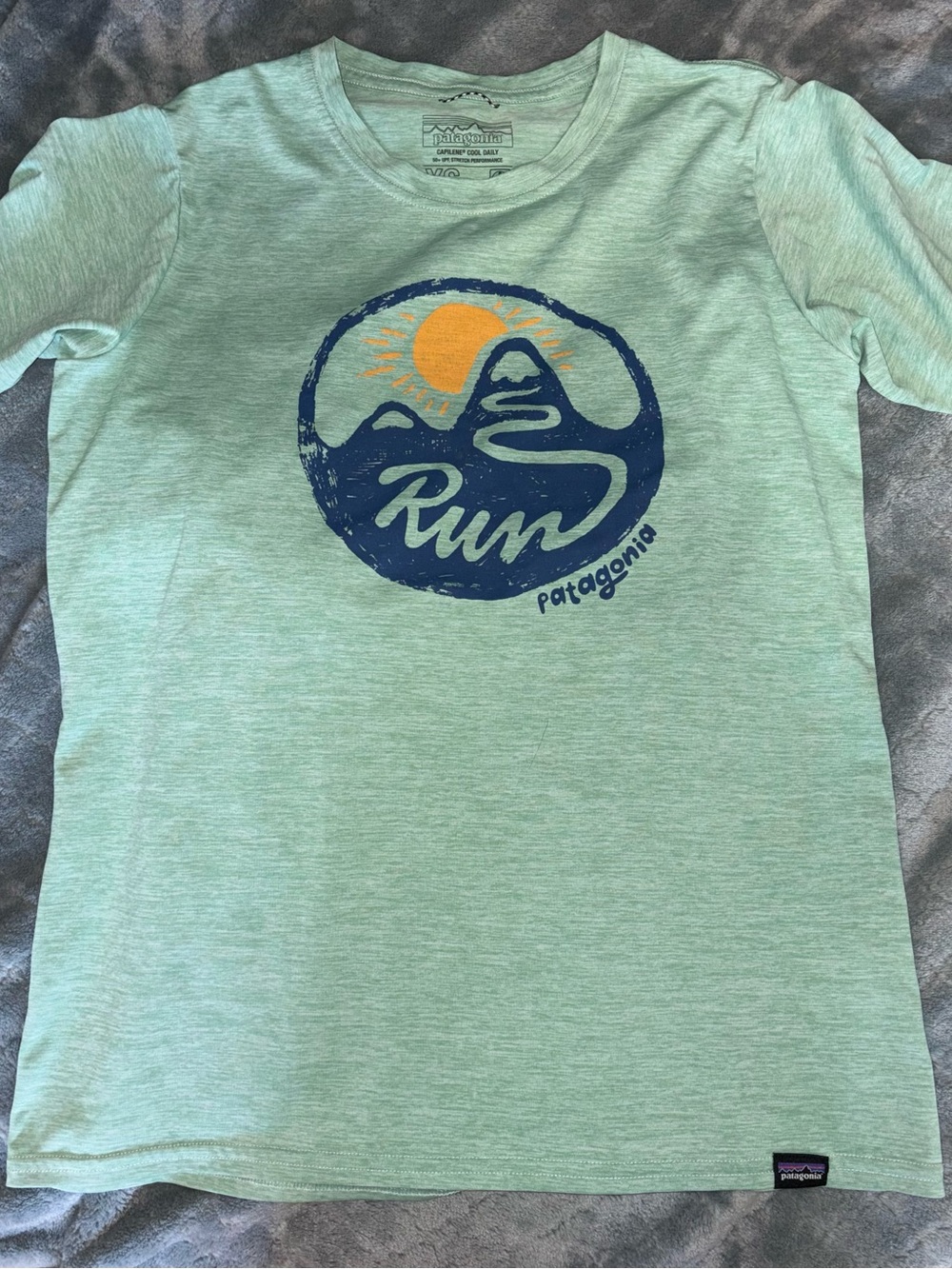 Patagonia Mint Green Graphic Tee with Sun Motif